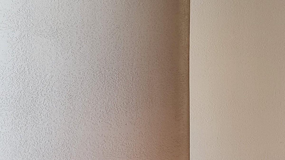 a white wall with a brown surface