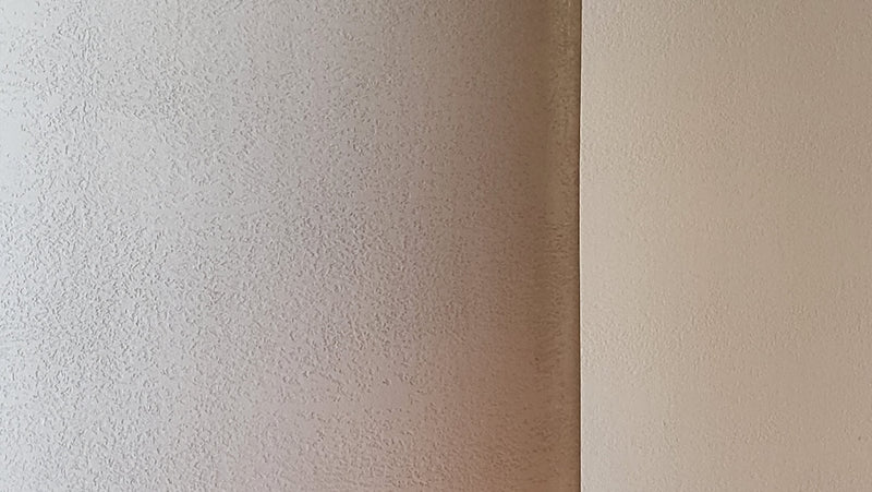a white wall with a brown surface