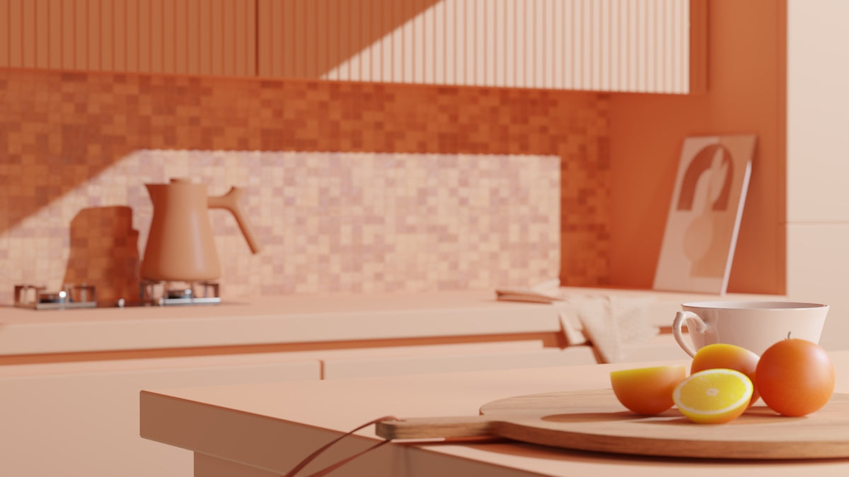 a plate of oranges and a cup on a kitchen counter