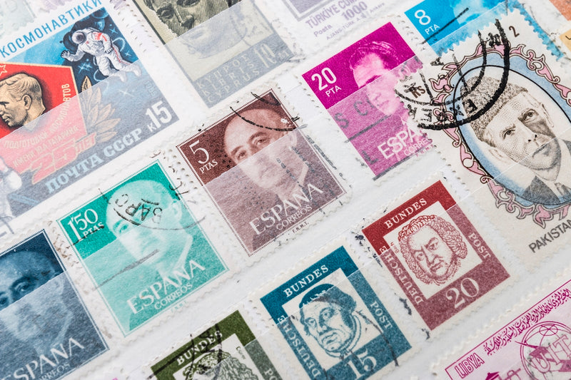A bunch of stamps that are on a table