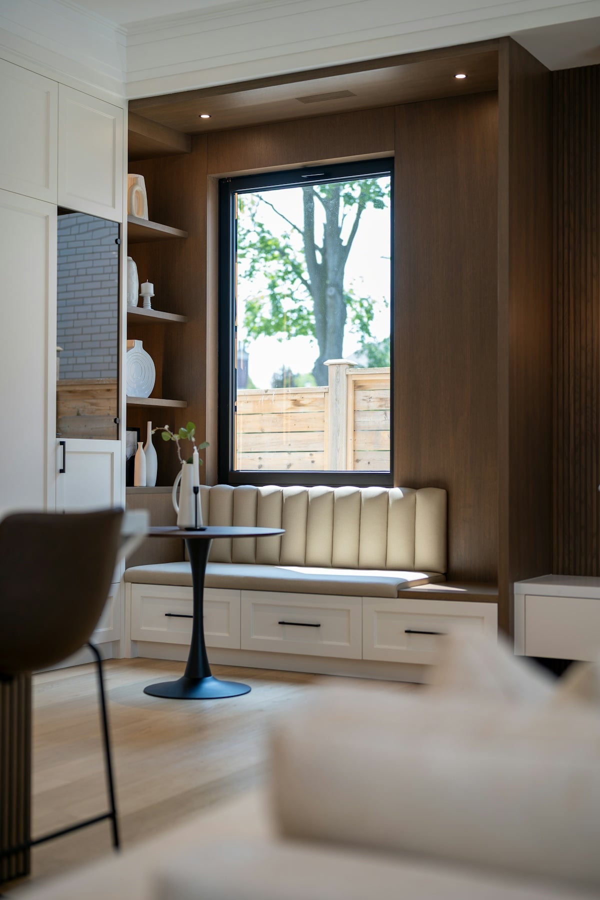 Modern interior with a window seat and small table